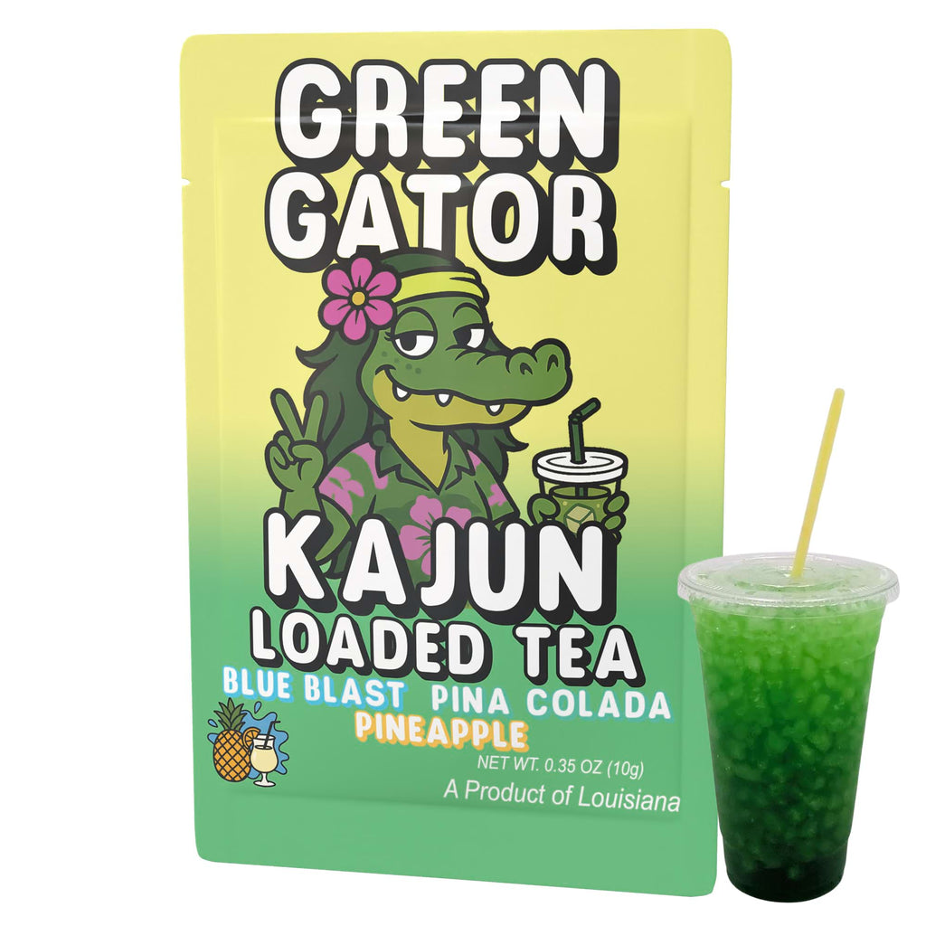 Image of the single Green Gator packet (with the Hawaiian-themed alligator) placed next to a clear cup of the prepared, intensely green-colored loaded tea.